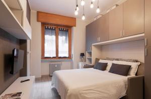 A bed or beds in a room at The Studio - Milano Centrale