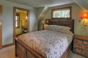 a bedroom with a large bed and a window at Stone Hill Overlook in Hermann