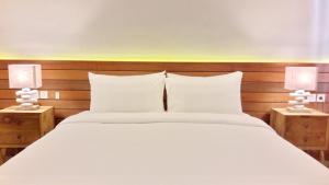 Letto o letti in una camera di Mantra Gili