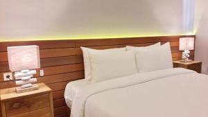 Letto o letti in una camera di Mantra Gili