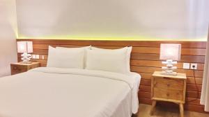 Letto o letti in una camera di Mantra Gili