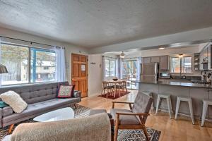a living room with a couch and a kitchen at Peaceful and Upscale Ski Cabin 11 Mi to Heavenly! in South Lake Tahoe