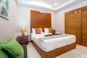 En eller flere senger på et rom på Private Villas Bangtao