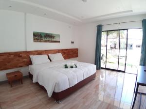 Кровать или кровати в номере Chinita Boutique Hotel +29 фотографий