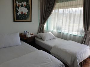 Кровать или кровати в номере Villa Jatimas Hijau