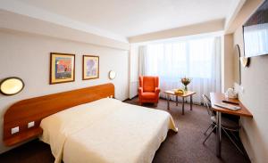 Posteľ alebo postele v izbe v ubytovaní Hotel Lux