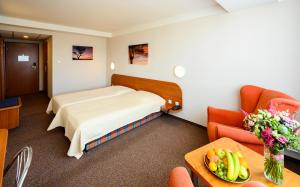 Posteľ alebo postele v izbe v ubytovaní Hotel Lux