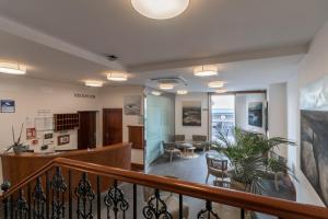a hallway with a staircase and a living room at Hotel Emblemático Holiday Time in Santa Cruz de la Palma