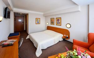 Posteľ alebo postele v izbe v ubytovaní Hotel Lux