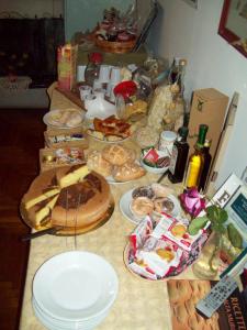 a table topped with lots of different types of food at B&B Stupor Mundi in Altamura