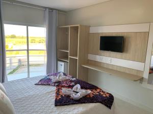 Ένα ή περισσότερα κρεβάτια σε δωμάτιο στο Hotel Santana - Itabatan BA +20 φωτογραφίες