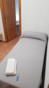 Postel nebo postele na pokoji v ubytování Plaza de España