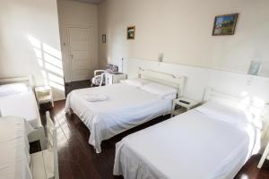 Postel nebo postele na pokoji v ubytování Hotel Pousada XV