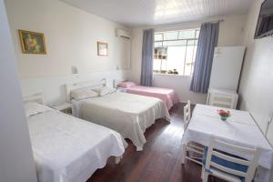 Postel nebo postele na pokoji v ubytování Hotel Pousada XV