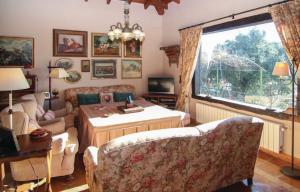 a living room with a couch and a table at El Encinar, Country House in Alanís, Andalusia in El Encinar