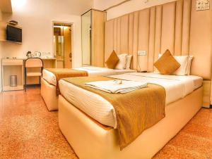 Postel nebo postele na pokoji v ubytování Hotel Samraj