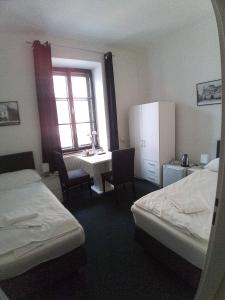 Voodi või voodid majutusasutuse Hotel Bílý Koníček toas