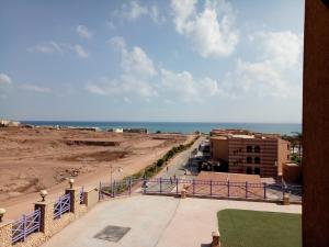 a view of the beach from the balcony of a building at one bedroom Chalet at Porto South Beach Royal Sea View Families only in Ain Sokhna