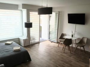 TV a/nebo společenská místnost v ubytování Apartment Laurot