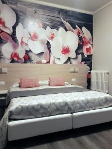 Postel nebo postele na pokoji v ubytování Albergo Paradiso