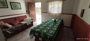 a living room with a couch and a table at Residencial Jade in Florianópolis +39 photos