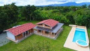 an aerial view of a house with a swimming pool at Finca la Flor del Café in Quimbaya