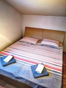 Postel nebo postele na pokoji v ubytování Tena Apartment