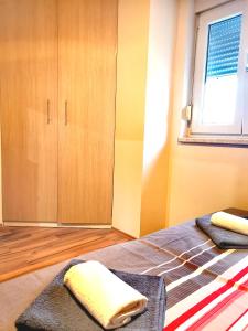 Postel nebo postele na pokoji v ubytování Tena Apartment