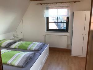 Postel nebo postele na pokoji v ubytování Ferienwohnung "Grünes Tor" bei Dresden