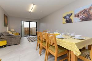 a dining room with a table and some chairs at Park View - 4 Star Luxury in Belfast