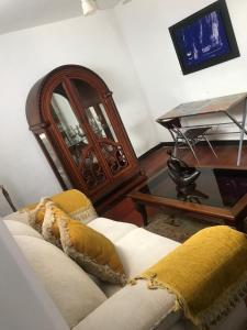 a living room with a couch and a table at Hotel Colonial - Salamina Caldas in Salamina