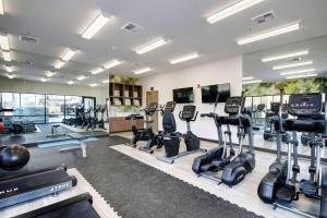 a gym with treadmills and cardio equipment in a room at Wyndham Garden Sacramento Airport Natomas in Sacramento