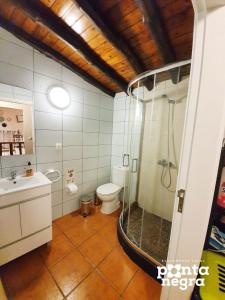 Ванная комната в Alojamento Ponta Negra