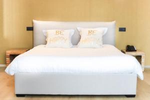 Giường trong phòng chung tại Hotel d'Alcantara