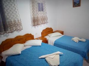 Letto o letti in una camera di Hotel Perissa