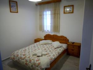 Letto o letti in una camera di Hotel Perissa