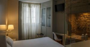 Postel nebo postele na pokoji v ubytování Hotel Atalaia