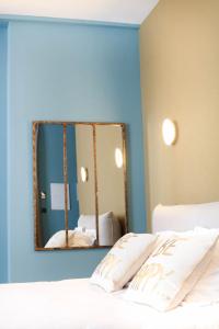 Giường trong phòng chung tại Hotel d'Alcantara