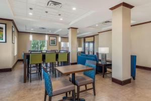 a dining room with a table and chairs at Comfort Inn & Suites in Big Spring