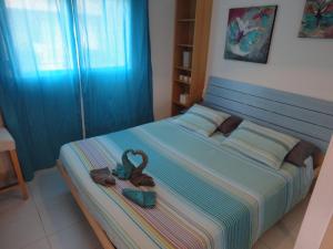 A bed or beds in a room at LasVistasApartment Még 37 kép