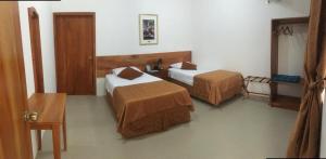 Cama o camas de una habitación en New Galapagos Hostelling