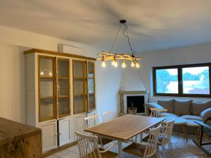 a living room with a table and a couch at Trullo Labellavita in Putignano +26 photos