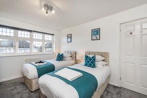 Ένα ή περισσότερα κρεβάτια σε δωμάτιο στο Cozy 3 Bedroom House in Aveley, Thurrock