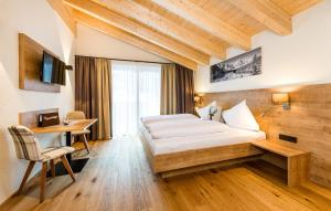 Giường trong phòng chung tại Landhaus Moosbrugger