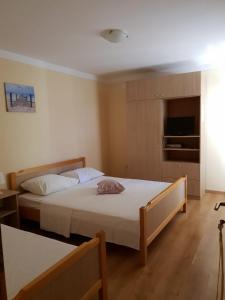Postel nebo postele na pokoji v ubytování Apartmani BM Bošnjak
