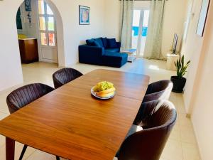 a dining room table with a plate of food on it at Helios Apartments - Beach of Lachania Rhodes in Lakhania