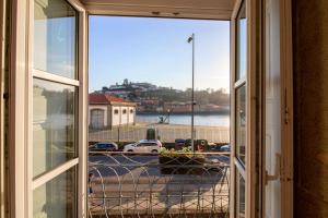 a view out a window of a house at Happy Porto Hostel & Apartments in Porto