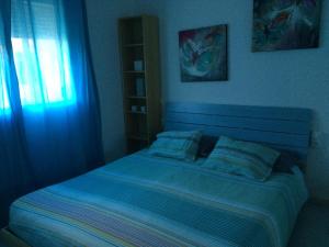 A bed or beds in a room at LasVistasApartment