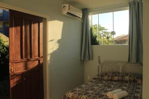Voodi või voodid majutusasutuse Pousada das Dunas Via Praia Apart Hotel toas