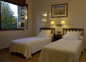 Postel nebo postele na pokoji v ubytování Hotel Celisol Cerdagne